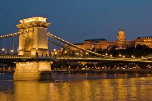 Rivers Gallery: The Chain Bridge (Szechenyi Lanchid), over the River Danube, illuminated at sunset with the Hungarian National Gallery also lit