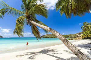 Cheerful woman sunbathing in the crystal Caribbean sea, Antigua, Leeward Islands, West Indies, Caribbean Cheerful woman sunbathing in the crystal Caribbean sea, Antigua, Leeward Islands, West Indies, Caribbean