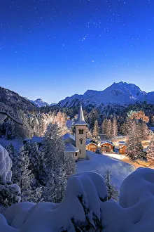 Places Of Worship Gallery: Chiesa Bianca covered with snow under a bright starry night sky at Christmas, Maloja, Bregaglia