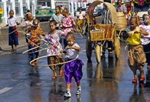Children playing and parading in streets during King Narai Reign Fair Children playing and parading in streets during King Narai Reign Fair
