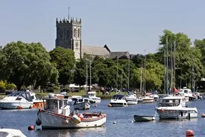 Images Dated 17th June 2010: Christchurch Priory and pleasure boats on the River Stour, Dorset, England