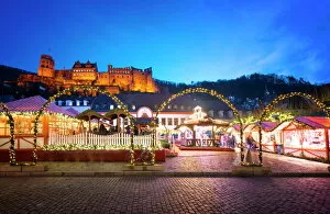 Ruined Gallery: Christmas Market at Karlsplatz in the old town of Heidelberg, with Castle Heidelberg, Heidelberg