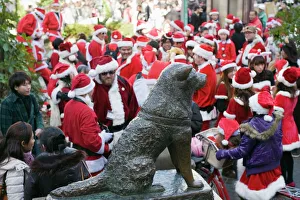 Christmas Santas meeting at Hachiko dog meeting point, Shibuya ward, Tokyo, Japan, Asia Christmas Santas meeting at Hachiko dog meeting point, Shibuya ward, Tokyo, Japan, Asia