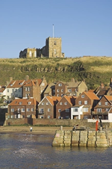 Church, sandy beach and harbour, Whitby, North Yorkshire, Yorkshire, England Church, sandy beach and harbour, Whitby, North Yorkshire, Yorkshire, England