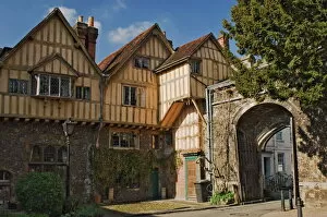 Timber Gallery: A city gate with timbered infilled gabled building, Winchester, Hampshire