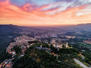 Cityscape of Narni at sunrise, with the fortress at the front and the old town beyond Cityscape of Narni at sunrise, with the fortress at the front and the old town beyond