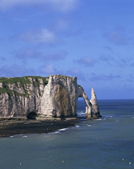 Cliffs and rock arch, known as the Falaises, on the coast near Etretat Cliffs and rock arch, known as the Falaises, on the coast near Etretat