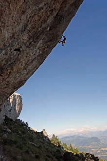 A climber ascends a difficult route on the cliffs of Ceuse, a mountain in the Alpes Maritimes A climber ascends a difficult route on the cliffs of Ceuse, a mountain in the Alpes Maritimes