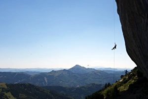 A climber ascends a rope on the cliffs of Ceuse, a mountain in the Alpes Maritimes A climber ascends a rope on the cliffs of Ceuse, a mountain in the Alpes Maritimes
