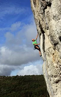 A climber tackles a very difficult rock climb in the Gorge d'Aveyron, near St