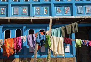 Close up of colourful laundry hanging in front of blue Close up of colourful laundry hanging in front of blue