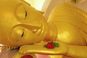 Human Face Gallery: Close up of the head of a reclining Buddha statue