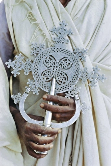 Close up of priest holding cross, Church of Narga Selassie, Lake Tana, Gondar Close up of priest holding cross, Church of Narga Selassie, Lake Tana, Gondar