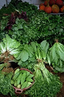 Close-up of greens for sale on a stall in the vegetable