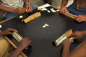 Images Dated 27th July 2008: Close-up of the hands of a group of four people playing dominos in the street Centro Habana