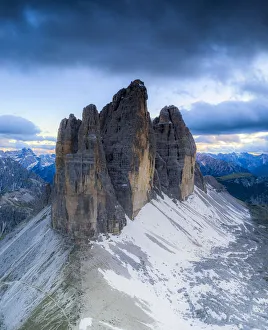 Clouds over the majestic peaks of Tre Cime di Lavaredo, aerial view Clouds over the majestic peaks of Tre Cime di Lavaredo, aerial view