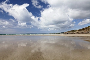 Clouds reflecting in the water at the beach of Pentrez Plage, Finistere, Brittany, France Clouds reflecting in the water at the beach of Pentrez Plage, Finistere, Brittany, France