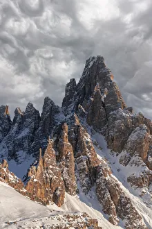 Clouds at sunset over the majestic rocks of Monte Paterno (Paternkofel), Sesto Dolomites Clouds at sunset over the majestic rocks of Monte Paterno (Paternkofel), Sesto Dolomites