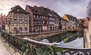 Colored houses reflected in River Lauch at sunset, Petite Venise, Colmar, Haut-Rhin department Colored houses reflected in River Lauch at sunset, Petite Venise, Colmar, Haut-Rhin department
