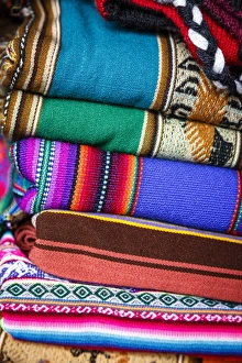 Colorful carpets made of llama and alpaca wool for sale at San Pedro market, Cuzco, Peru Colorful carpets made of llama and alpaca wool for sale at San Pedro market, Cuzco, Peru