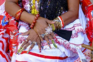 Colorful nails on the crossed hands of a lady in traditional dress, Old Havana, Cuba Colorful nails on the crossed hands of a lady in traditional dress, Old Havana, Cuba