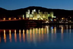 Illumination Collection: Conwy Castle and town at dusk, Conwy, Wales, United Kingdom, Europe