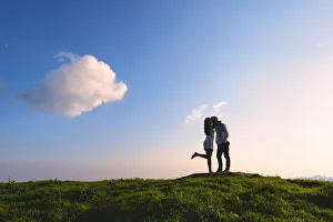 Couple in love just before sunset on Mount Guglielmo, Brescia pre-Alps in Lombardy Couple in love just before sunset on Mount Guglielmo, Brescia pre-Alps in Lombardy