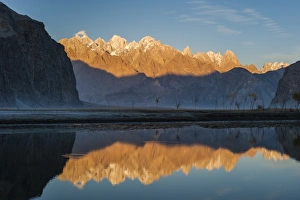 The crystal clear Shyok River creates a mirror image of sunrise on Karakoram peaks The crystal clear Shyok River creates a mirror image of sunrise on Karakoram peaks
