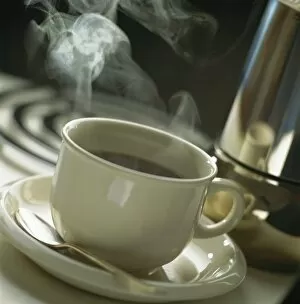 Saucer Gallery: Cup of steaming coffee
