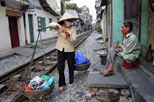 Daily life by the railway tracks in central Hanoi Daily life by the railway tracks in central Hanoi