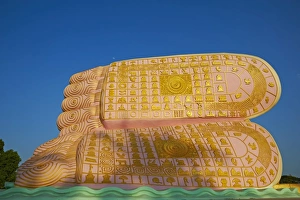 The decorated feet of the Mya Tha Lyaung reclining Buddha one of the largest in the world The decorated feet of the Mya Tha Lyaung reclining Buddha one of the largest in the world
