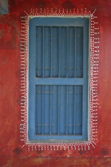 Decorated shuttered window in painted bhunga wall, Dhordo village, Kachchh Decorated shuttered window in painted bhunga wall, Dhordo village, Kachchh