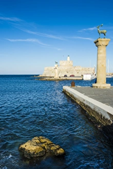 The deers, symbol of the city, at the entrance to Mandraki harbour, the Medieval The deers, symbol of the city, at the entrance to Mandraki harbour, the Medieval