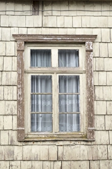 Distinctive wooden tiles around a window in Chiloe Island, Northern Patagonia, Chile Distinctive wooden tiles around a window in Chiloe Island, Northern Patagonia, Chile