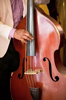 Detail of double bass being played by a local musician in Bar El Floridita, Havana, Cuba, West Indies, Central America