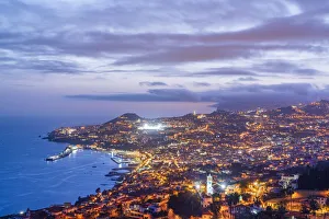 Dusk over the iIluminated city of Funchal viewed from Sao Goncalo, Madeira island Dusk over the iIluminated city of Funchal viewed from Sao Goncalo, Madeira island