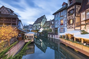 Dusk lights on houses reflected in River Lauch at Christmas, Petite Venise, Colmar Dusk lights on houses reflected in River Lauch at Christmas, Petite Venise, Colmar