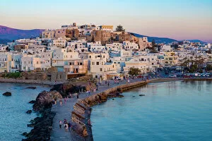 Aegean Sea Gallery: Dusk over Naxos town and causeway to The Porta Gateway, part of the unfinished Temple of Apollo