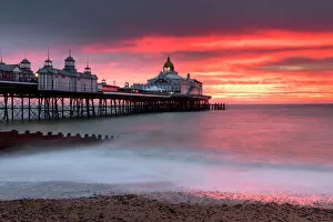 Dramatic Sky Gallery: Eastbourne Pier against fiery red sky at sunrise, Eastbourne, East Sussex, England