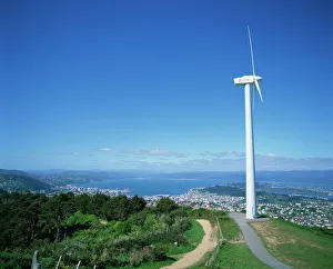 ECNZ Wind turbine generator on a hill above the city ECNZ Wind turbine generator on a hill above the city