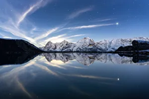 Eiger, Monch and Jungfrau mountains mirrored in Engital lake under the stars, Murren Birg Eiger, Monch and Jungfrau mountains mirrored in Engital lake under the stars, Murren Birg
