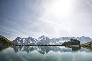 Eiger, Monch and Jungfrau peaks reflected in the unspoiled Engital lake, Murren Birg Eiger, Monch and Jungfrau peaks reflected in the unspoiled Engital lake, Murren Birg