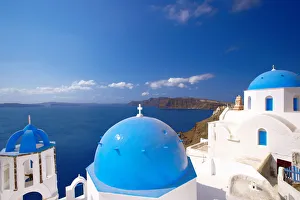 Elevated view of the Aegean Sea from a top of a church with blue domed roofs, Santorini Elevated view of the Aegean Sea from a top of a church with blue domed roofs, Santorini