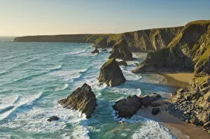Images Dated 15th June 2009: Evening light on the rock stacks, beach and rugged coastline at Bedruthan Steps