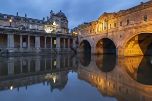 Evening lights illuminating Pulteney Bridge in Bath, UNESCO World Heritage Site, Somerset Evening lights illuminating Pulteney Bridge in Bath, UNESCO World Heritage Site, Somerset
