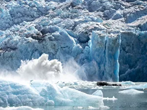 The face of glacier calving off on the South Sawyer Glacier, Tracy Arm, Southeast Alaska The face of glacier calving off on the South Sawyer Glacier, Tracy Arm, Southeast Alaska