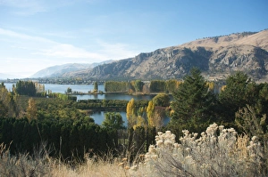 Fall colors on river in rocky agricultural valley, Methow Valley, Washington State Fall colors on river in rocky agricultural valley, Methow Valley, Washington State