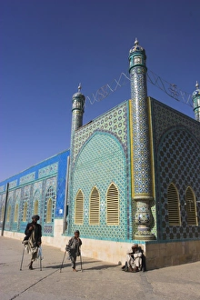 Father and son amputees outside the Shrine of Hazrat Ali, who was assassinated in 661 Father and son amputees outside the Shrine of Hazrat Ali, who was assassinated in 661