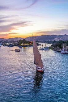Aswan Collection: Feluccas on The River Nile at sunset, Aswan, Egypt, North Africa, Africa