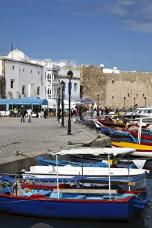 Fishing boats, old port canal with kasbah wall in background, Bizerte, Tunisia Fishing boats, old port canal with kasbah wall in background, Bizerte, Tunisia